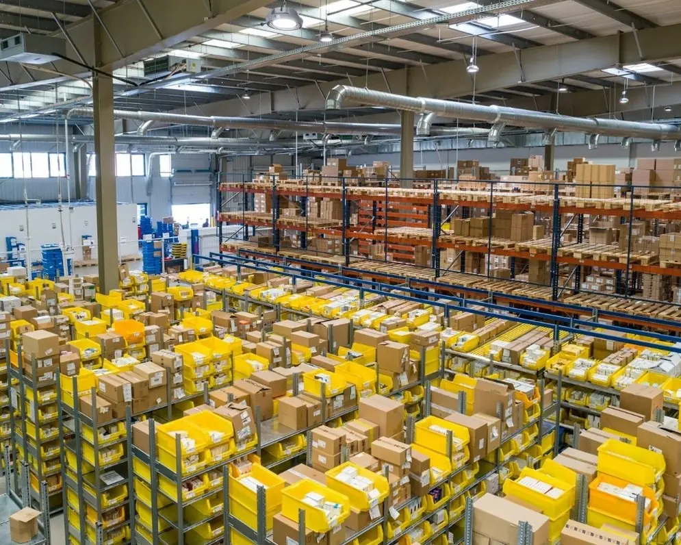 A fulfilment warehouse with rows of bins