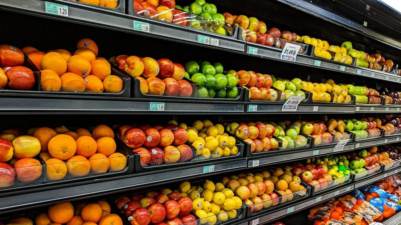 Grocery shelves stocked with fruit