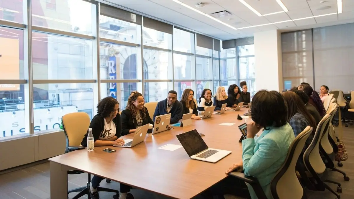 A team around a long boardroom table