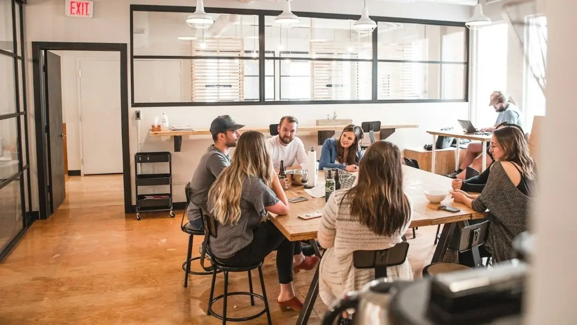 A team working around a table in an open office