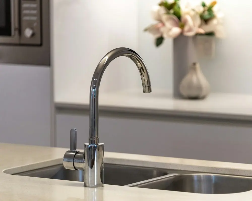 A kitchen faucet over a double sink
