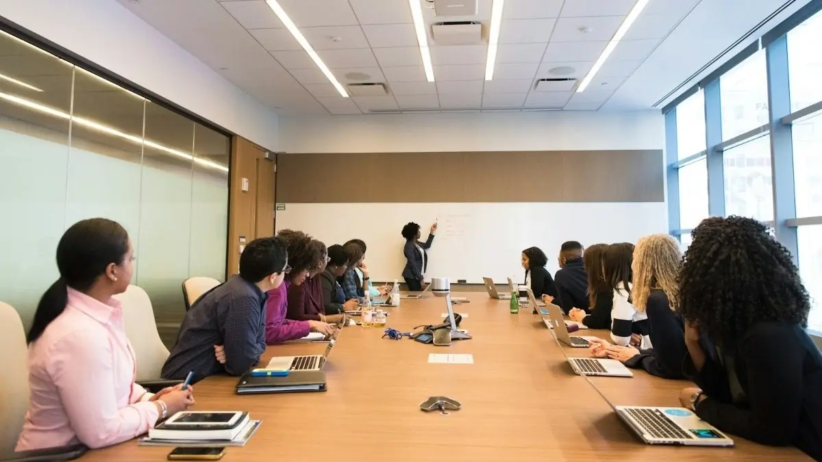 A team meeting around a long conference table