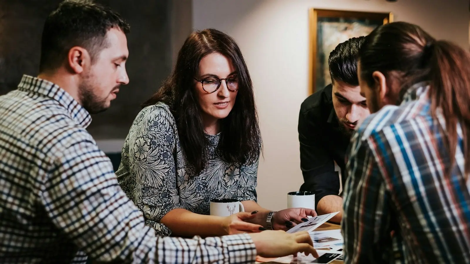 A team going over printouts at a table