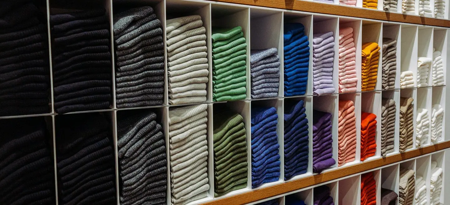A merch team checking a run of printed apparel