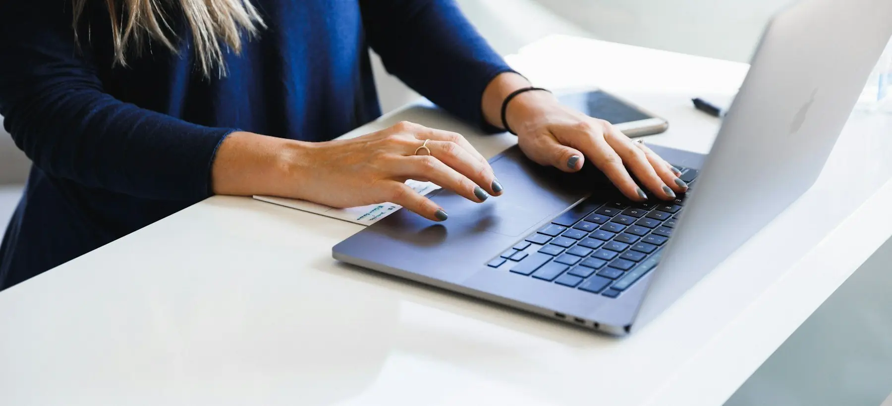 A founder writing outbound email at a laptop