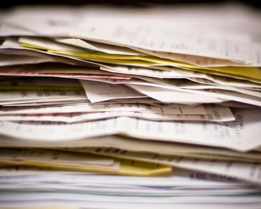 A tall stack of paperwork