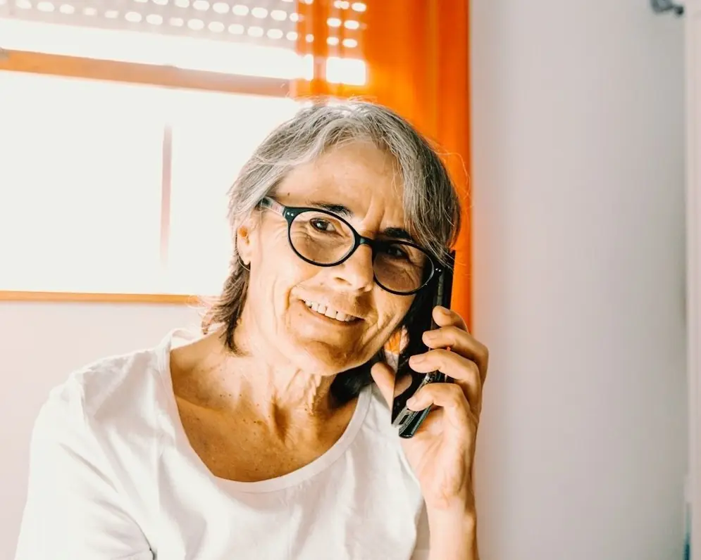 A woman smiling on a phone call