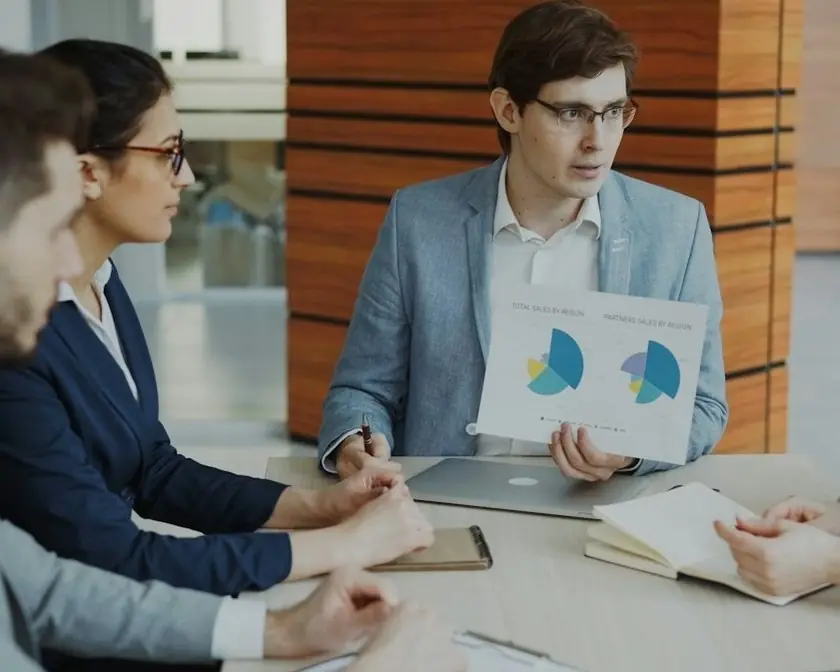 A team reviewing charts in a meeting